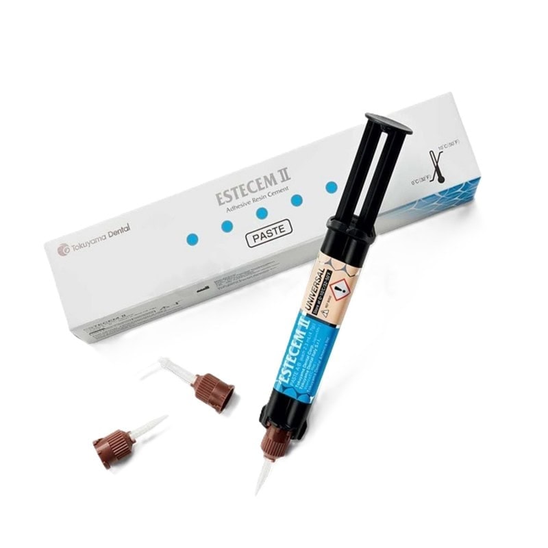 Resina adhesiva para odontología personalizada, estecem II, en envase con jeringa y accesorios para uso dental profesional.