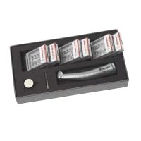 Turbina odontológica personalizada EXAmedic en caja con accesorios y cabezales de alta precisión para profesionales dentales.