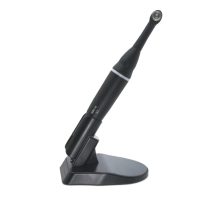 Borrador dental inalámbrico con base de carga, dispositivo de tecnología avanzada para tratamientos odontológicos precisos.